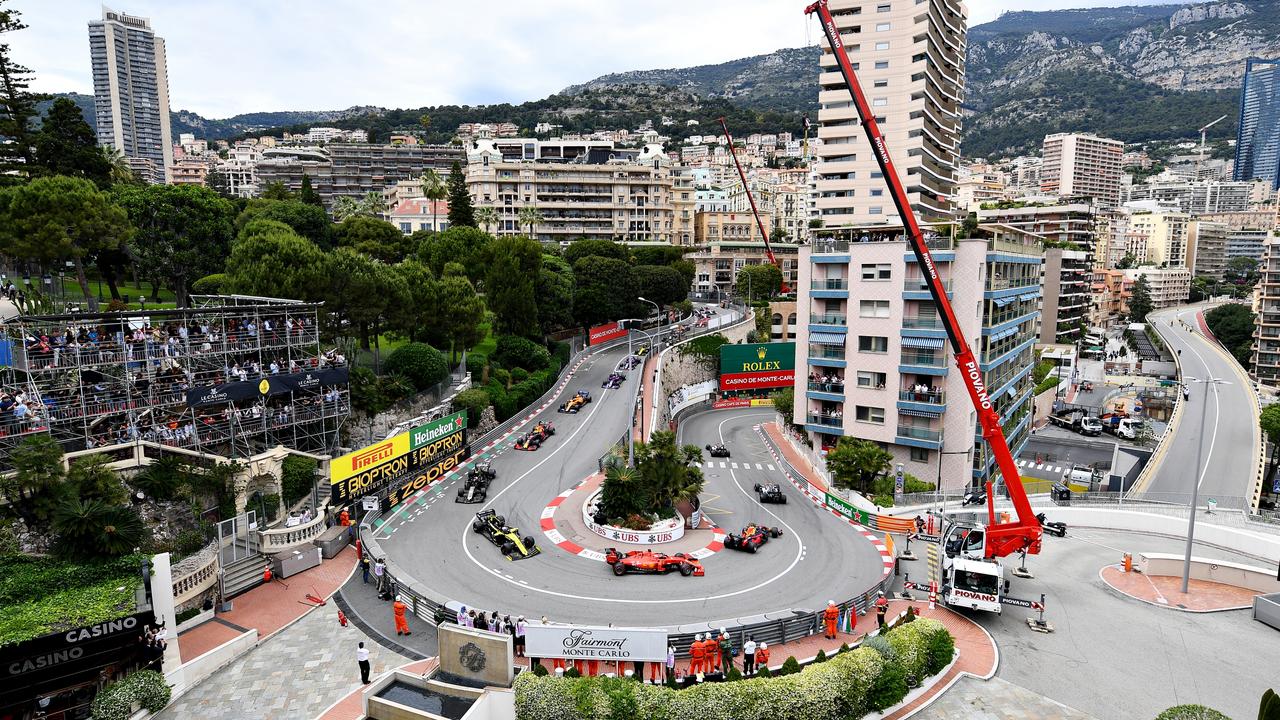 MONTE-CARLO, MONACO - MAY 26: A general view of the start at the Fairmont Hairpin showing Max Verstappen of the Netherlands driving the (33) Aston Martin Red Bull Racing RB15 and Sebastian Vettel of Germany driving the (5) Scuderia Ferrari SF90 during the F1 Grand Prix of Monaco at Circuit de Monaco on May 26, 2019 in Monte-Carlo, Monaco. (Photo by Michael Regan/Getty Images)