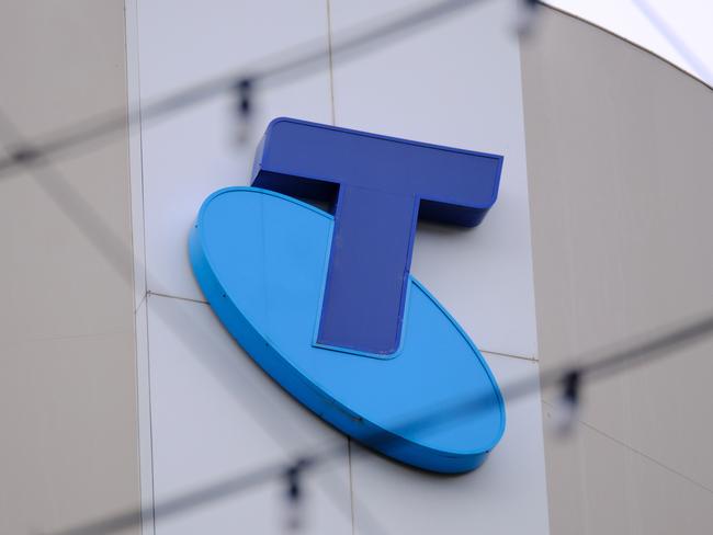 MELBOURNE, AUSTRALIA - NewsWire Photos OCTOBER 4, 2022. Generic photo people walking past the Telstra logo in Melbourne..Picture: NCA NewsWire / Luis Enrique Ascui