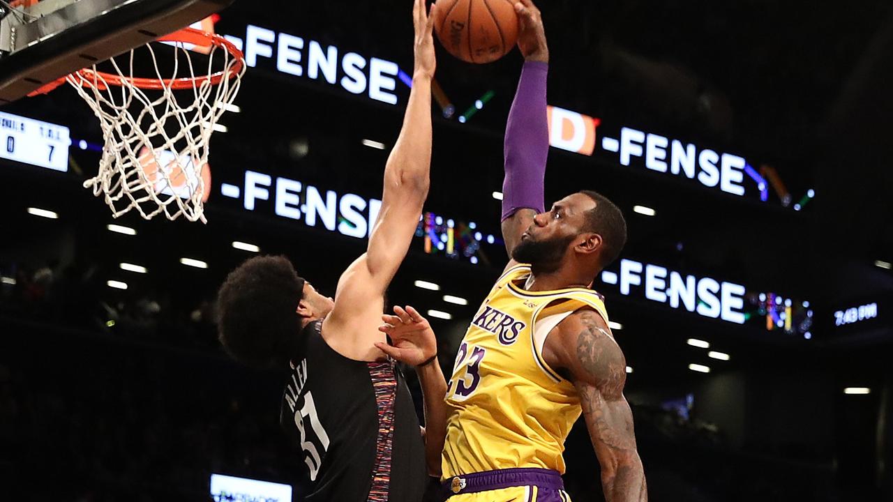 Jarrett Allen blocks the shot of LeBron James.