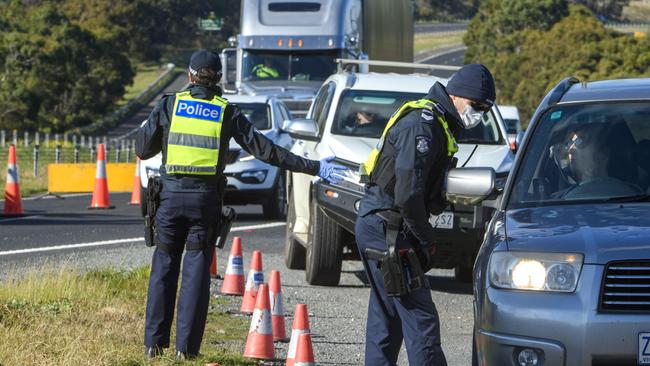 Police check motorists at a checkpoint on the Calder Freeway at Gisborne South. Picture: Jay Town