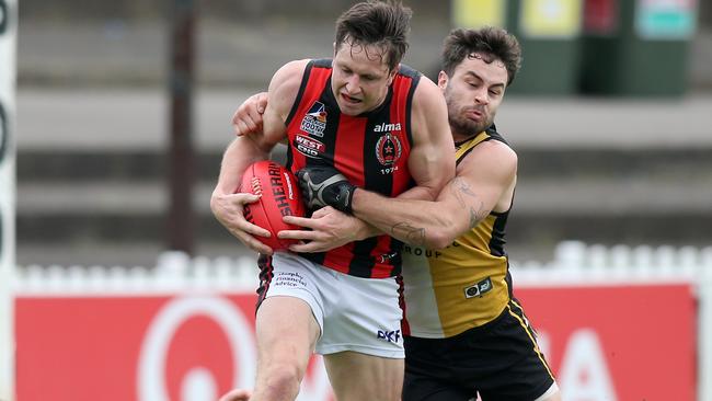 ROC’s Charles Jordan is tackled by Goodwood’s Jacob Hughes during the 2020 division one grand final at Norwood Oval. Picture Dean Martin