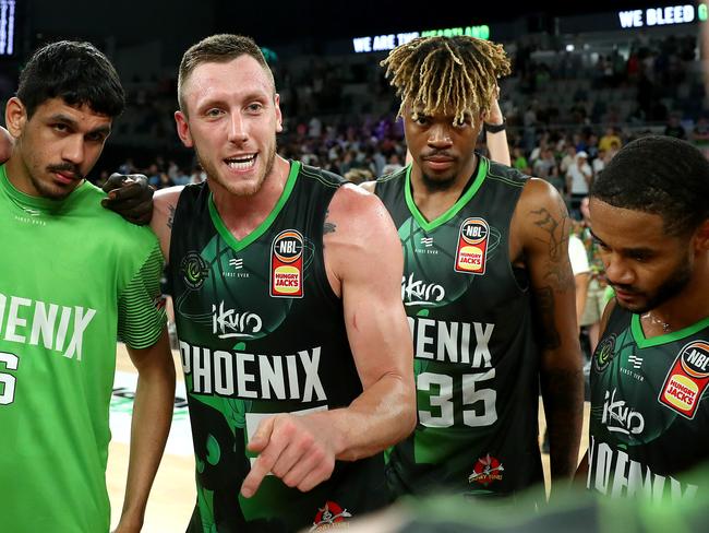 Mitchell Creek celebrates the win with teammates at Melbourne Arena.