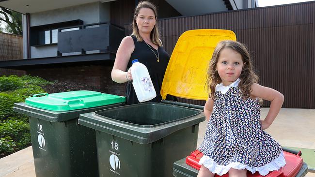 Lauren Busch with her daughter Estelle 2yrs at home in Pascoe Vale Sth with their recycling bins.Recycling collection costs have jumped almost 300% per bin in some Melbourne councils as they struggle to deal with China's ban on recycled material and the collapse of waste giant SKM. Picture : Ian Currie