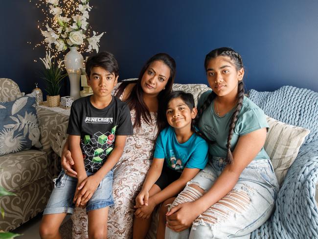 Mum Iram Siddiqui, with daughter Mariam (11) and two sons, Aamir (7) & Maahir (5) who are suffering from higher power prices. Picture: Tim Pascoe