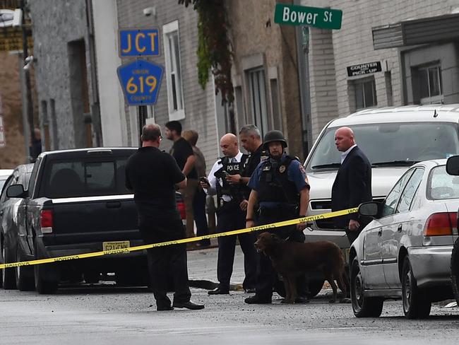 Law inforcement officers secure the area where they allegedly arrested terror suspect Ahmad Khan Rahami following a shootout in Linden, New Jersey, on September 19, 2016.