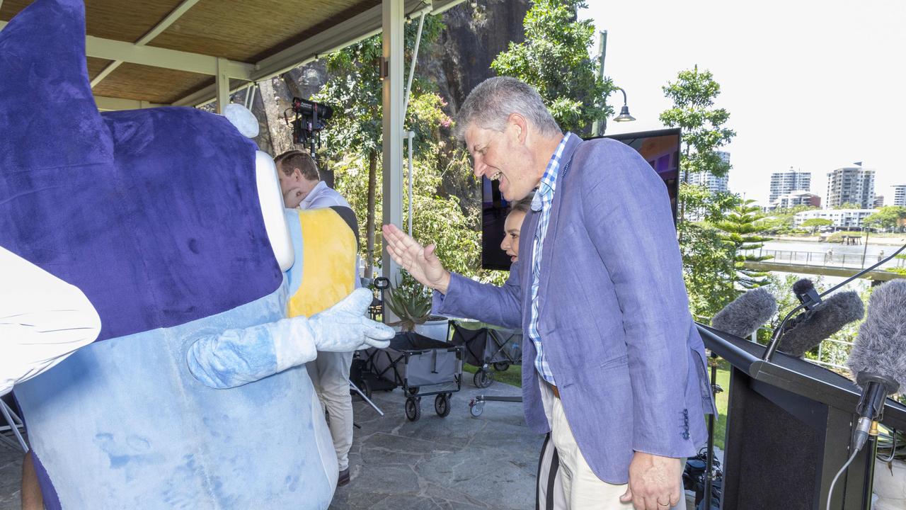 Queensland Tourism Minister Stirling Hinchliffe gives Bluey a high-five. Picture: Richard Walker