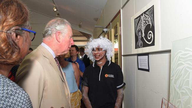 Yirrkala student Kaya Munununggurr discusses her artwork with Charles, Prince of Wales at the Buku-Larrnggay Mulka Centre Picture: Keri Megelus