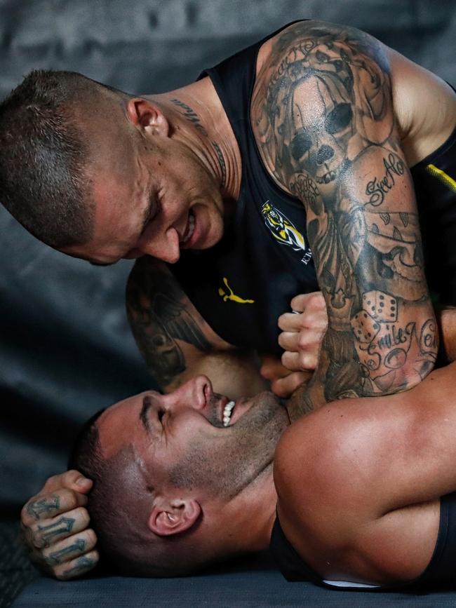 Dustin Martin grapples with Shaun Grigg. Picture: AFL Media