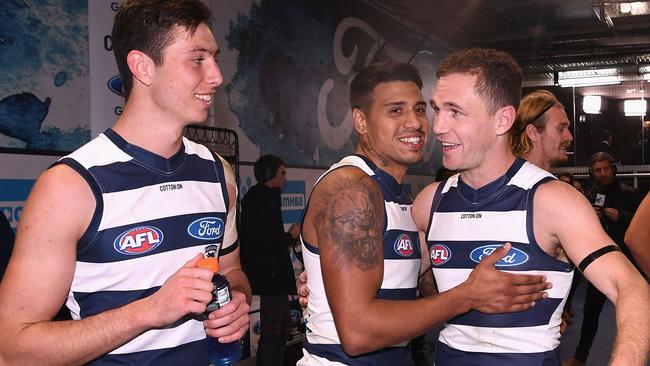 Jack Henry (left) enjoys a Geelong win with childhood hero Joel Selwood.