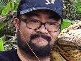 A supplied image obtained Thursday, Feb. 4, 2016 of tourist Mark Pierrot holds a Coconut Crab, the largest land living arthropod in the world, on Christmas Island. (AAP Image/Mark Pierrot, The Christmas Island Tourism Association) NO ARCHIVING, EDITORIAL USE ONLY