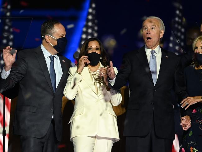 -- AFP PICTURES OF THE YEAR 2020 --  US President-elect Joe Biden (R) and Vice President-elect Kamala Harris (2nd L) react as confetti falls, with Jill Biden (R) and Douglas Emhoff, after delivering remarks in Wilmington, Delaware, on November 7, 2020, after being declared the winners of the presidential election. (Photo by Jim WATSON / AFP)