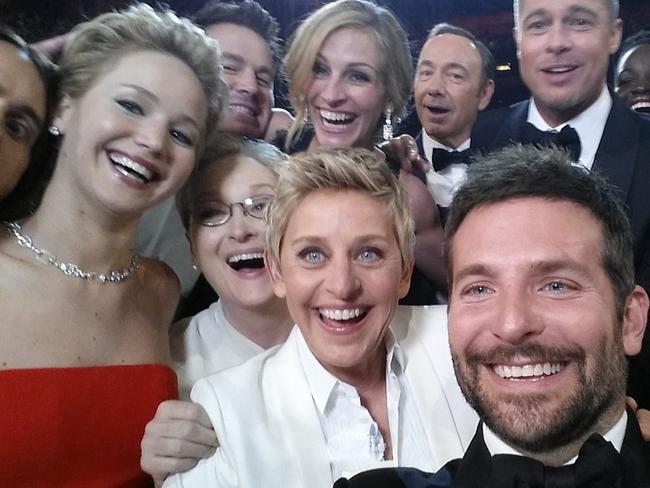 Host Ellen DeGeneres poses for a selfie taken by Bradley Cooper with Jared Leto, Jennifer Lawrence, Channing Tatum, Meryl Streep, Julia Roberts, Kevin Spacey, Brad Pitt, Lupita Nyong’o, Angelina Jolie, Peter Nyong’o Jr. and Bradley Cooper during the 86th Annual Academy Awards at the Dolby Theatre on March 2, 2014 in Hollywood, California. (Photo credit Ellen DeGeneres/Twitter via Getty Images)