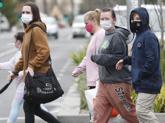 Masks very obvious in Geelong CBD on Sunday. Among them were a couple of buskers. Picture: Alan Barber