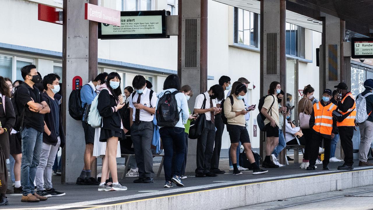 Commuters waiting for a tram this morning at Central Station, Sydney. Picture: NCA NewsWire / James Gourley