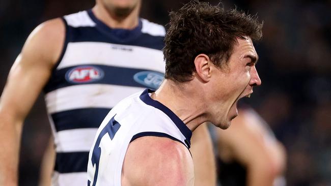 Jeremy Cameron celebrates one of his three-final quarter goals as the Cats hit overdrive. Picture: AFL Photos via Getty Images