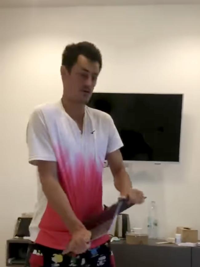 Bernard Tomic picked up his girlfriend’s laptop in the shocking video.