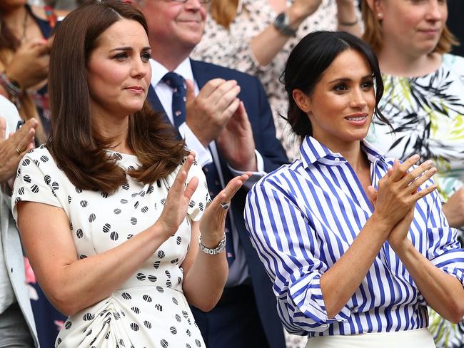 LONDON, ENGLAND - JULY 14:  Catherine, Duchess of Cambridge and Meghan, Duchess of Sussex applaud ahead of the Ladies' Singles final match between Serena Williams of The United States and Angelique Kerber of Germany on day twelve of the Wimbledon Lawn Tennis Championships at All England Lawn Tennis and Croquet Club on July 14, 2018 in London, England.  (Photo by Michael Steele/Getty Images)