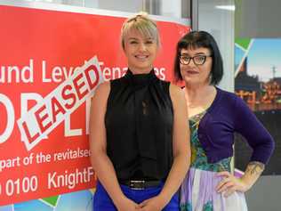 LEASED: Knight Frank representative Louise Slater celebrates a new lease with tenant Work Connection CEO Katie Bright. Picture: Ashley Pillhofer