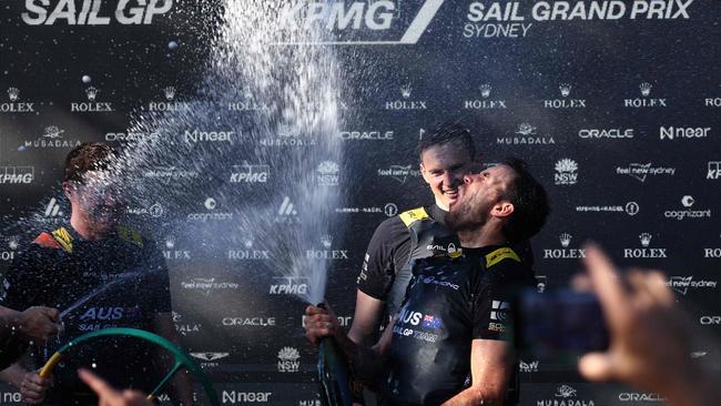 How sweet it is. The Aussies celebrate their win. Picture: David Gray/AFP.