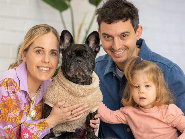Eleanor, 2 and Tom and Sarah with Picnic 7 yo French Bulldog.Picnic, who is paralysed, was adopted by the couple.has had three surgeries and is paralysed. Picture: Jason Edwards