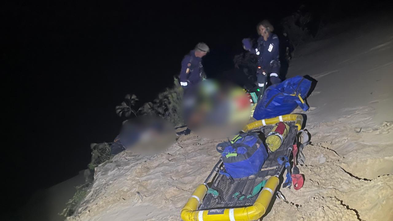 Watch: Injured paraglider winched to safety after crashing into 80m cliff