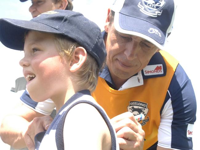 Thompson signing an autograph on a fan’s jersey before his fall from grace.