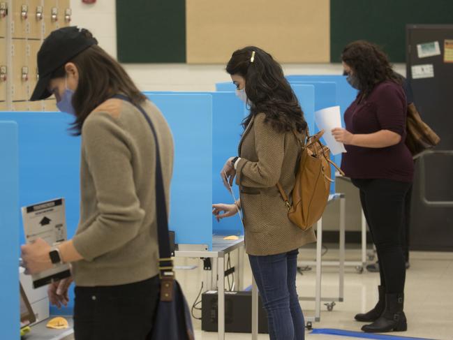 People cast early votes for the Presidential election in the Kelly High School in Chicago, Illinois, USA. Picture: Angus Mordant for News Corp Australia