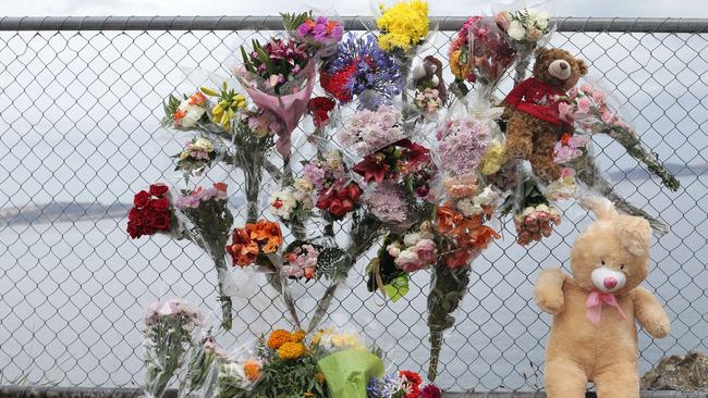 Tributes continue to be added at the scene of the fatal accident of Margaret Lore, who fell off the Blackmans Bay cliffs on Saturday night. Picture: LUKE BOWDEN