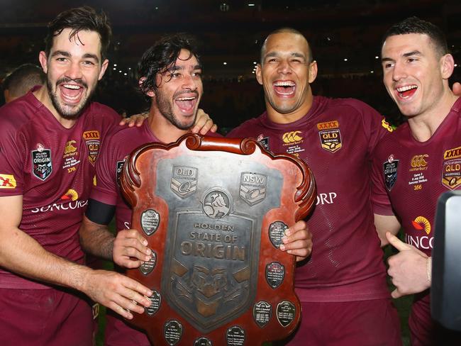 BRISBANE, AUSTRALIA - JULY 08:  Aidan Guerra, Johnathan Thurston, Will Chambers and Darius Boyd of the Maroons celebrate victory during game three of the State of Origin series between the Queensland Maroons and the New South Wales Blues at Suncorp Stadium on July 8, 2015 in Brisbane, Australia.  (Photo by Mark Kolbe/Getty Images)