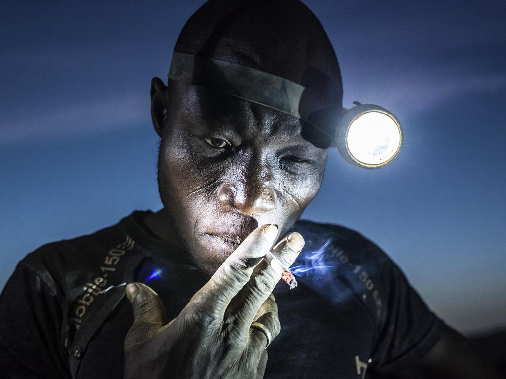 “Digging the Future” by photographer Matjaz Krivic which won second prize in the People singles category shows a mine worker taking a smoke break before going back into the pit. Miners in Bani face harsh conditions and exposure to toxic chemicals and heavy metals. Image taken in Bani, Burkina Faso, on Nov. 20, 2015. (Matjaz Krivic, World Press Photo via AP)