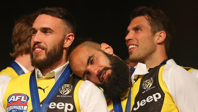 RiShane Edwards at Richmond’s grand final celebrations with teammate Bachar Houli and Alex Rance. Picture: Scott Barbour/Getty Images