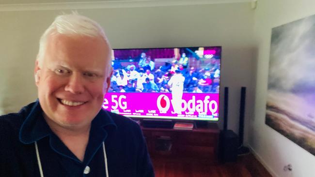 Kiama MP Gareth Ward watching the cricket while isolating at home a day after testing positive for Covid via a rapid antigen test.