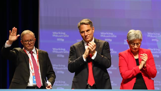 Prime Minister Anthony Albanese, Deputy Prime Minister Richard Marles and Minister for Foreign Affairs Penny Wong react after AUKUS was passed during the ALP National Conference in Brisbane. Picture: NCA NewsWire/Tertius Pickard