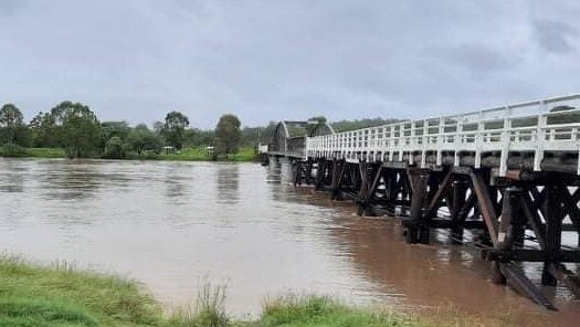 Flood water lapping at bottom of the 21m tall Dickabram Bridge