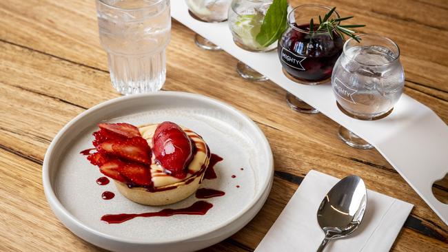 A flight of gins to taste is a good match with the strawberries and cream dessert.