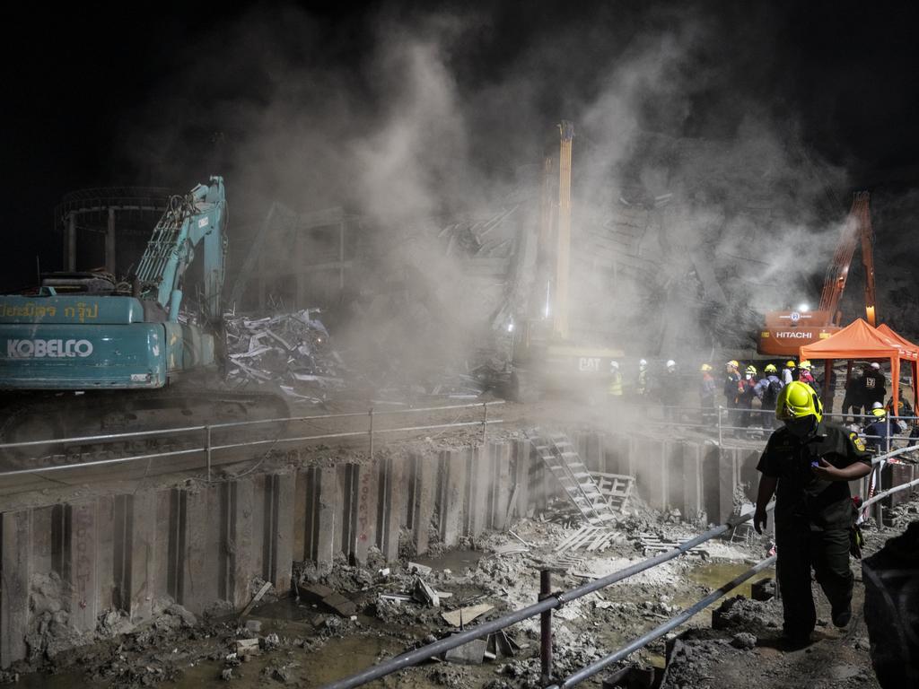 Dust cloud disperses in the air while removing debris during a search and rescue operation at a collapsed under-construction skyscraper in Bangkok, Thailand. Picture: Sirachai Arunrugstichai/Getty Images