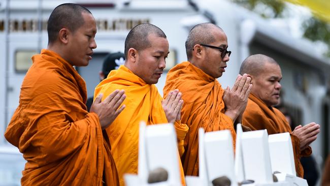 Buddhists pray outside the Tree of Life synagogue. Picture: AFP