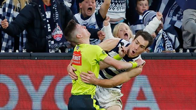 Jeremy Cameron collides with boundary umpire Matthew Tomkins at full pace late in the final quarter. Picture: Dylan Burns/AFL Photos via Getty Images