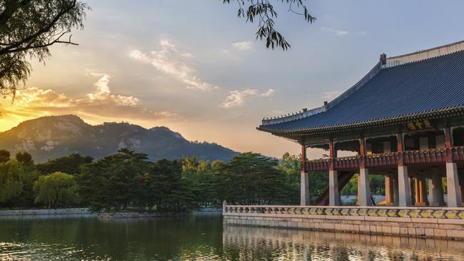 Gyeonghweru Pavilion reflected in a lake at Gyeongbokgung Palace in Seoul.