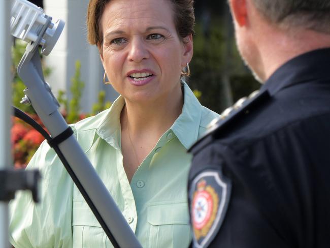 Federal communications Minister Michelle Rowland with an NBN satellite antenna in the foreground, at a press conference in Townsville on May 18. Picture: Blair Jackson.