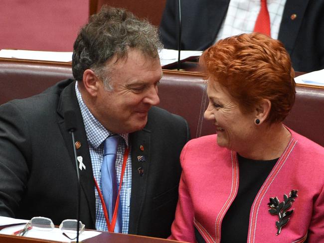 **FILE** A  Nov. 24, 2016 file image of One Nation Senators Rodney Culleton and Pauline Hanson during the Backpacker Tax Bill vote in the Senate chamber at Parliament House in Canberra. Disqualified senator Rod Culleton was not eligible to have been elected in the first place, the High Court has ruled, Friday, Feb. 3, 2017.  (AAP Image/Mick Tsikas) NO ARCHIVING