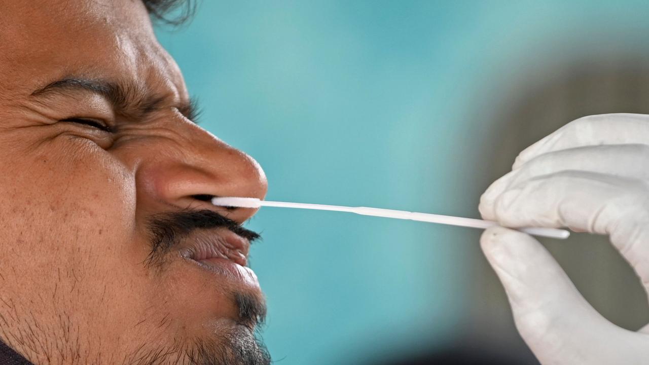 A nasal swab should be inserted a couple of centimetres into the nose. Photo by Indranil Mukherjee/AFP