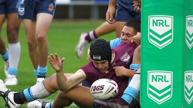 Action from the Australian state schools national rugby league championship match between Queensland Maroon and NSW CHS. Queensland's Marley Mclaren scores a try. Picture: Tertius Pickard