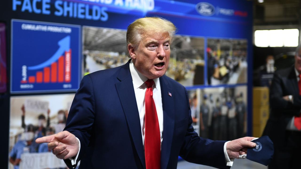 US President Donald Trump holds a mask as he speaks during a tour of the Ford Rawsonville Plant in Ypsilanti, Michigan on May 21, 2020. Picture: Brendan Smialowski/AFP