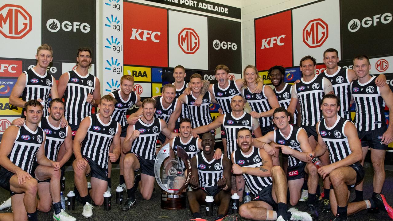 Port Adelaide celebrate their Showdown victory in the change rooms whilst wearing their prison bar guernseys. Picture Mark Piovesan Photography