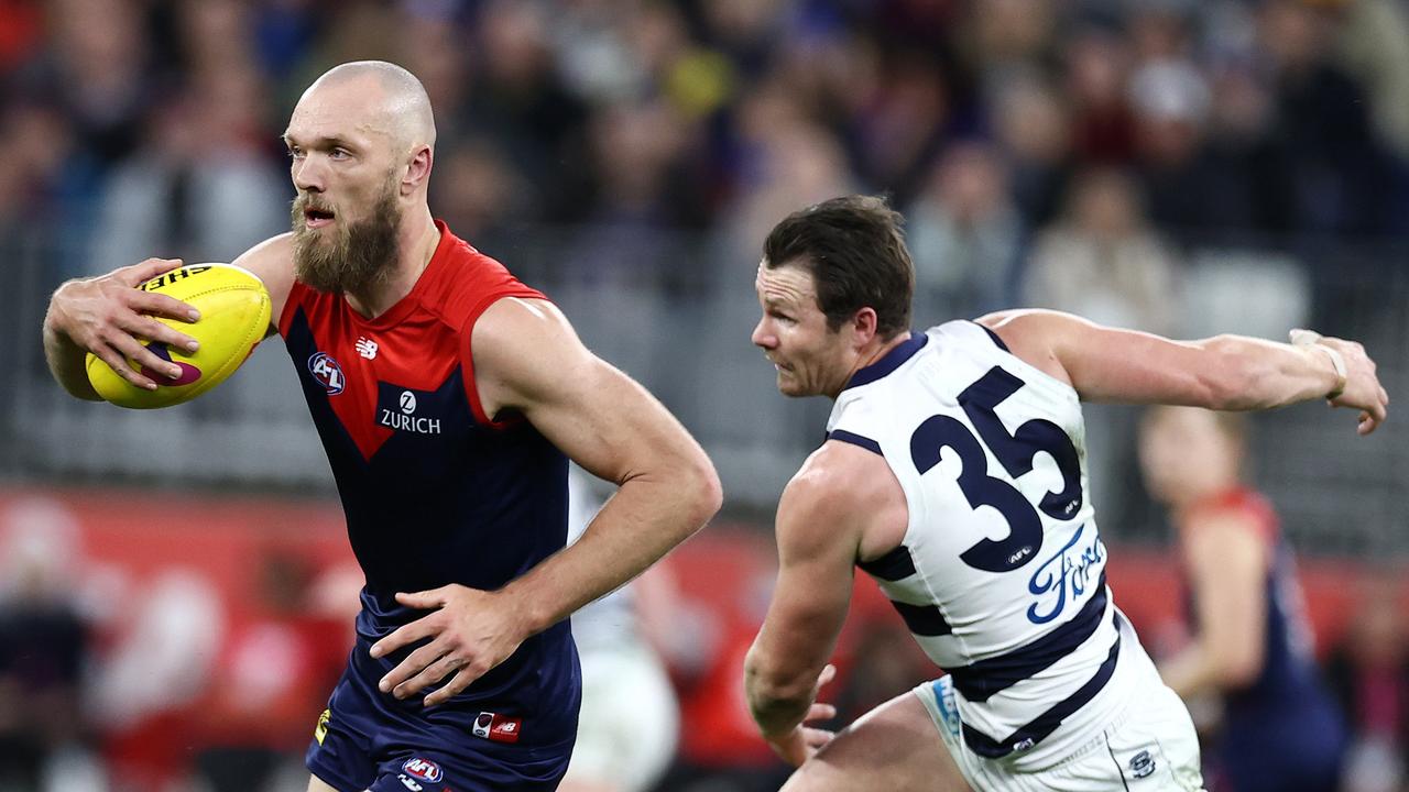 Melbourne star Max Gawn canters past Geelong’s Patrick Dangerfield. Picture: Michael Klein