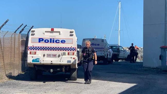 Police at the scene of the arrest in Mackay Harbour this afternoon. Picture: Melanie Whiting