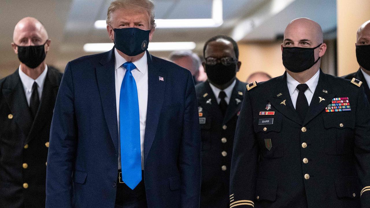 Donald Trump was finally spotted wearing a face mask in public over the weekend. Picture: Alex Edelman/AFP