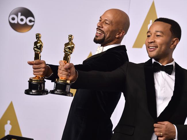 Political ... Best Song recipients, Common, left, and John Legend, said the struggles of black America persisted today, long after the death of Martin Luther King, Jr.