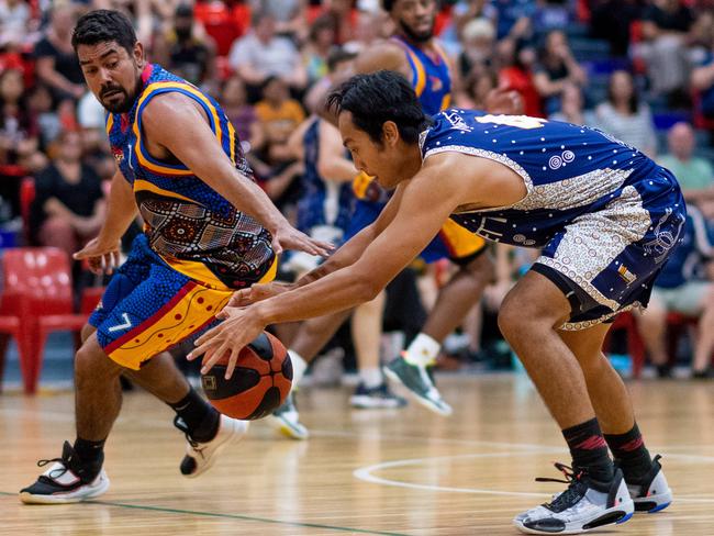 Ansett youngster Henry Bui (right) has started the 2021 Darwin Basketball League season well. Picture: Che Chorley